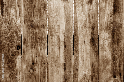 Weathered wooden fence in brown color.