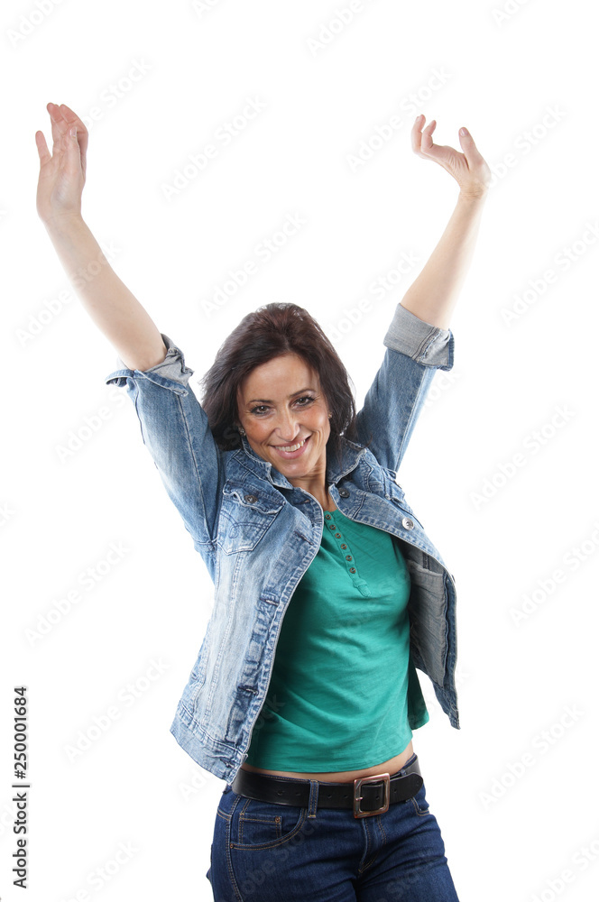 middle aged woman cheering with raised arms middle aged woman cheering with raised arms