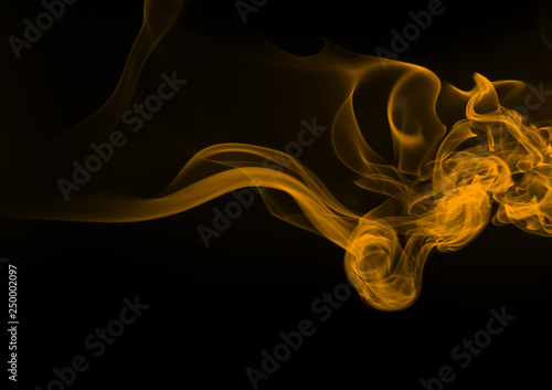 Beautiful movement yellow smoke abstract on black background, fire design