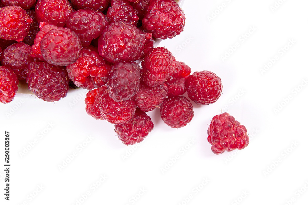 Harvested juicy ripe raspberries fruit on white background.. Harvested juicy ripe raspberries fruit on white background..