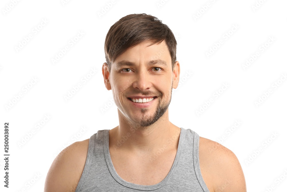 Handsome man having half of his face shaved against white background Handsome man having half of his face shaved against white background