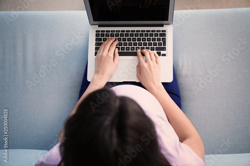 Beautiful pregnant woman us...