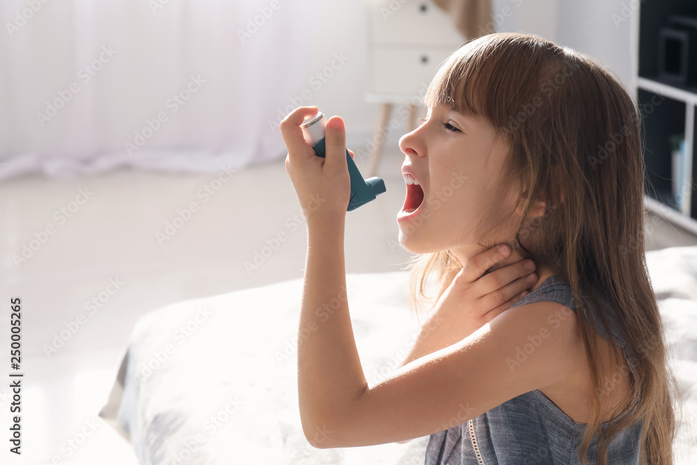 Little girl with inhaler having asthma attack at home Little girl with inhaler having asthma attack at home