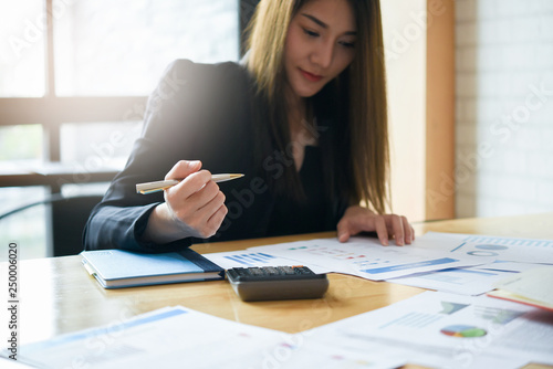 Close up view of bookkeeper or financial inspector hands making report  calculating or checking balance. Home finances  investment  economy  saving money or insurance concept