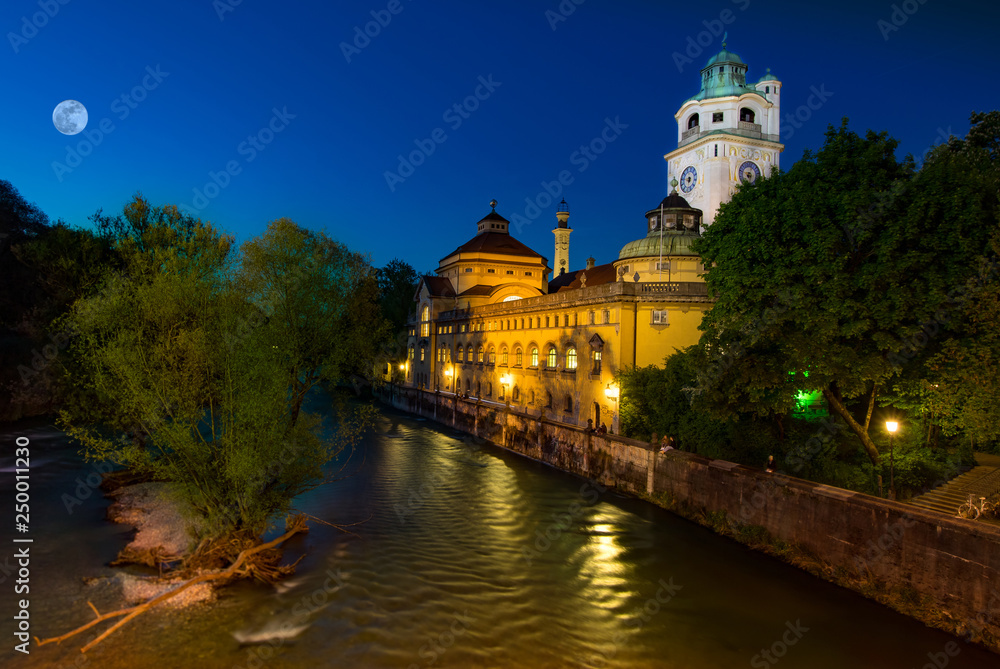oldest public swimming pool building in munich called Müllersches Volksbad. view from brigde over river Isar