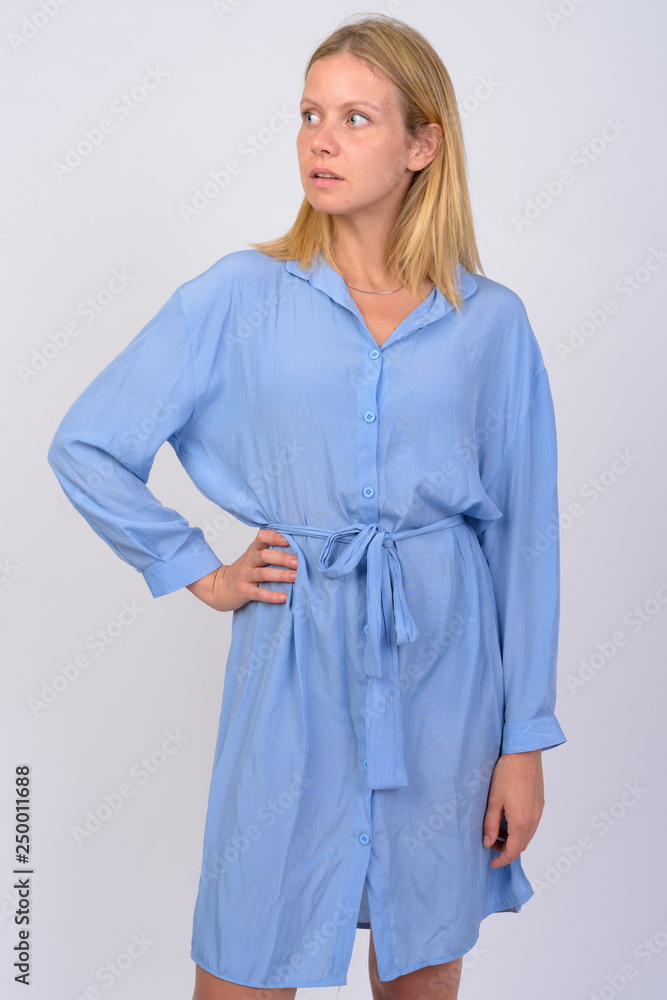 Portrait of young beautiful woman thinking and looking away