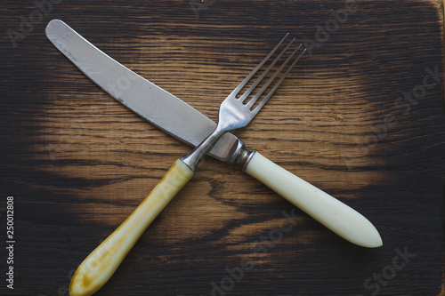cutlery on a wooden board