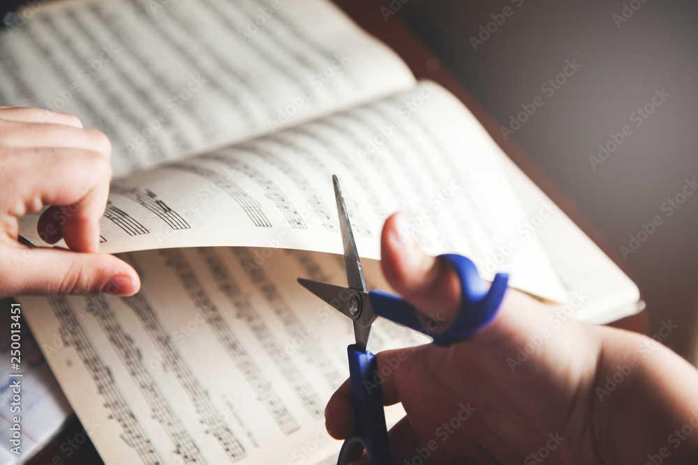 girl hand music notes with scissors girl hand music notes with scissors