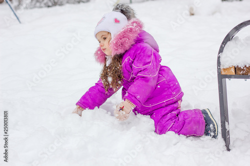Little kid girl playing in ...