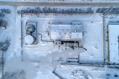 City boiler station. Smoke comes from chimneys. Top view photo