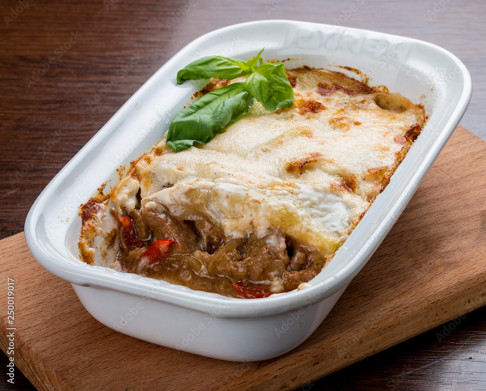 Lasagna with a rabbit in a ceramic bowl. Lasagna with a rabbit in a ceramic bowl.