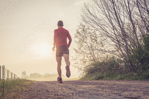 Man running in the country early in the morning