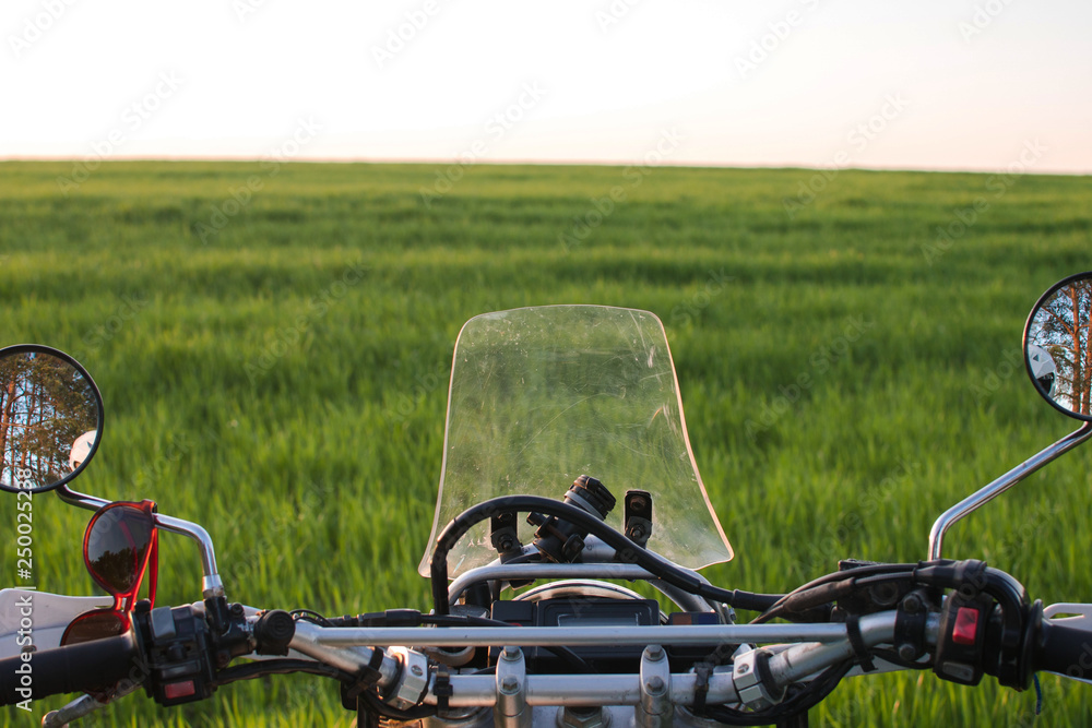 enduro off road Motorcycle on green grass hill landscape pine forest sunset enduro off road Motorcycle on green grass hill landscape pine forest sunset