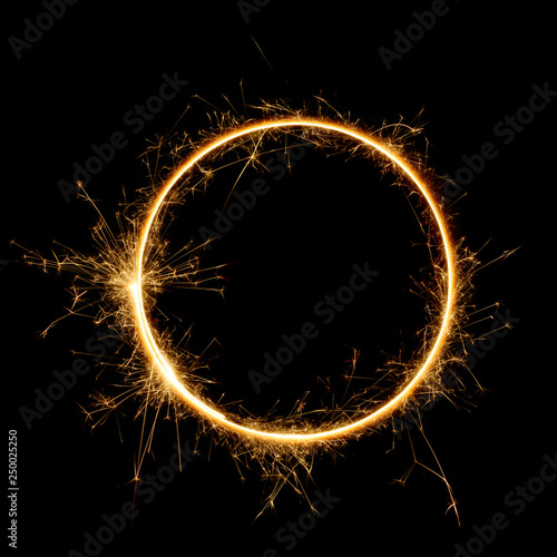 Sparkler circle shape. Burning bengal fire round letter o number zero, long exposure. Burning sparklers isolated on black.