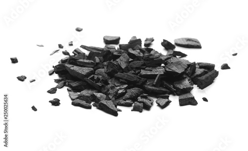 Black charcoal chunks, pile isolated on white background
