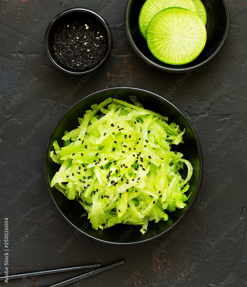 Salad from green radish with sesame Salad from green radish with sesame