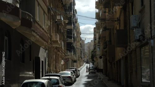 Shot of a street in Sliema, Valette, Malta, person photo