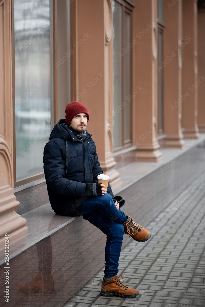 the guy is drinking coffee the guy is drinking coffee