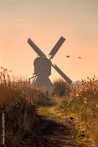 Twight light sunrise on the Unesco heritage windmill silhouette at the middle of the canal, Alblasserdam, Netherlands