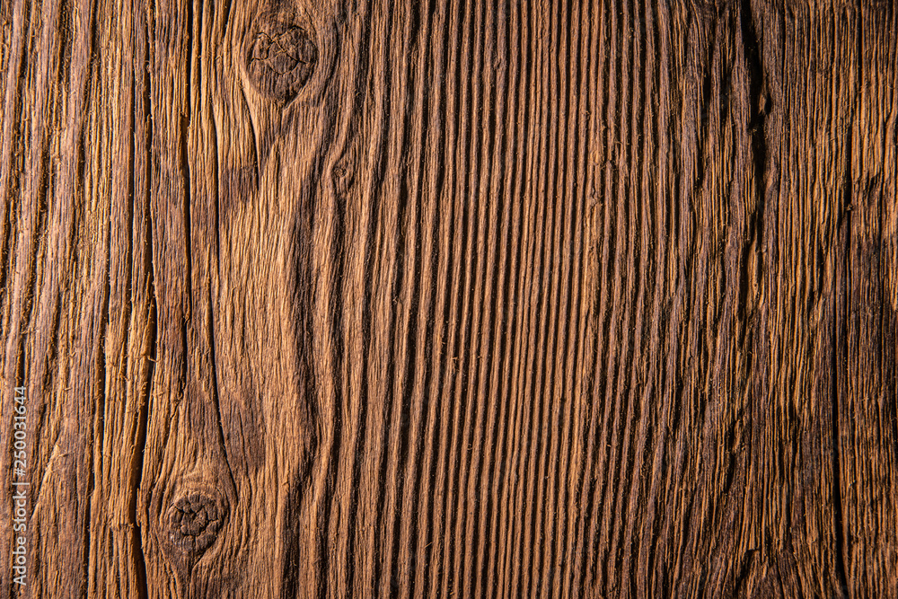 Old dark brown wooden wall, detailed background photo texture. Wood plank fence close up. Old dark brown wooden wall, detailed background photo texture. Wood plank fence close up.