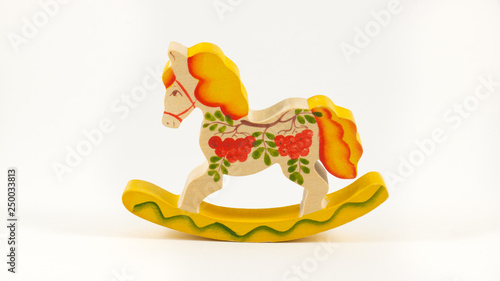 Colorful toy rocking horse on a white background