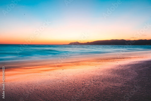 sunset on the beach © Gustavo