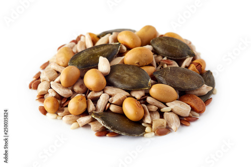 Mix of various healthy seeds including soy beans, sesame, pumpkin and sunflower seeds isolated on white background