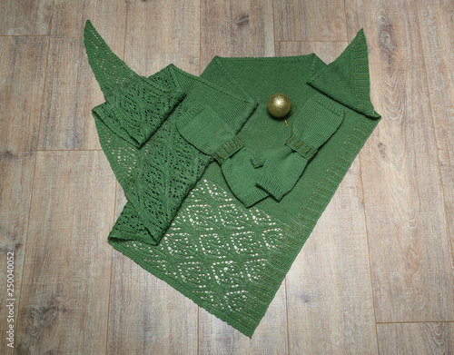 Knitted shawl on wooden background