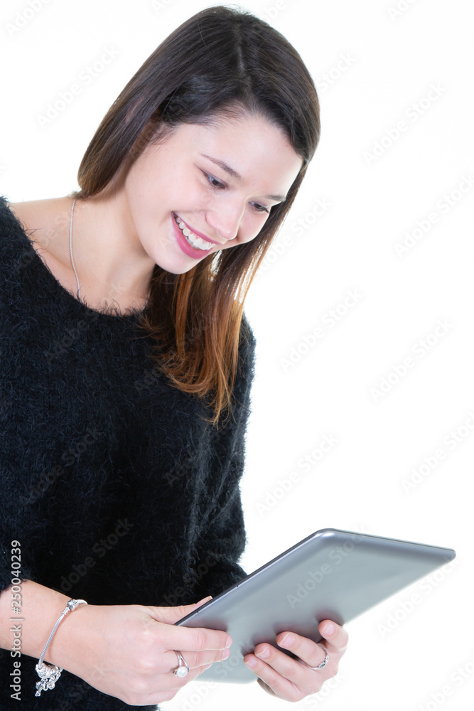 smiling young caucasian woman using tablet computer smiling young caucasian woman using tablet computer