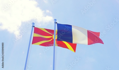 Macedonia and France, two flags waving against blue sky. 3d image