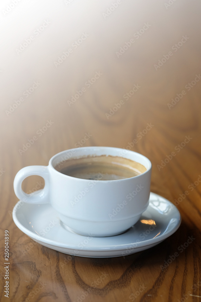 Well mixed hot black coffee in white coffee cup with space for write wording served in a restaurant in a coffee break time, popular drink for meeting place and party time, value added design for bette