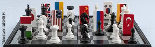 Fotografie Symbols of the flags of the world on the chessboard