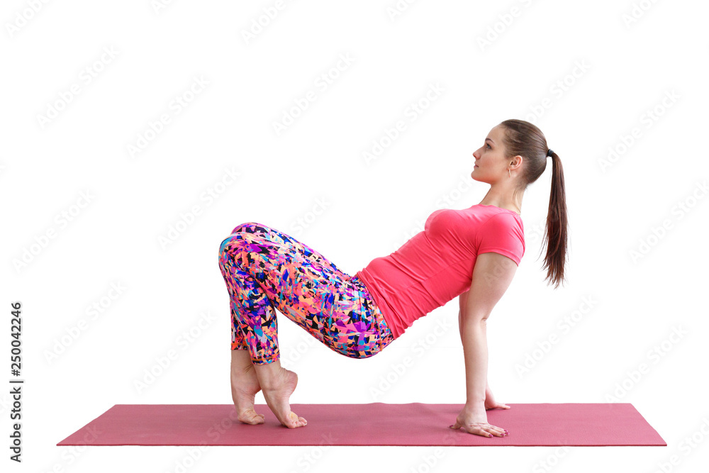 Young girl gymnast performs a workout on the Mat for fitness on a white background. Young girl gymnast performs a workout on the Mat for fitness on a white background.