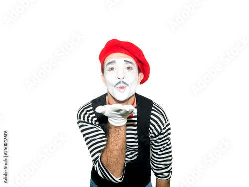 Man in striped sweater, white gloves sending air kiss. Clown, artist , mime. Isolated on white background