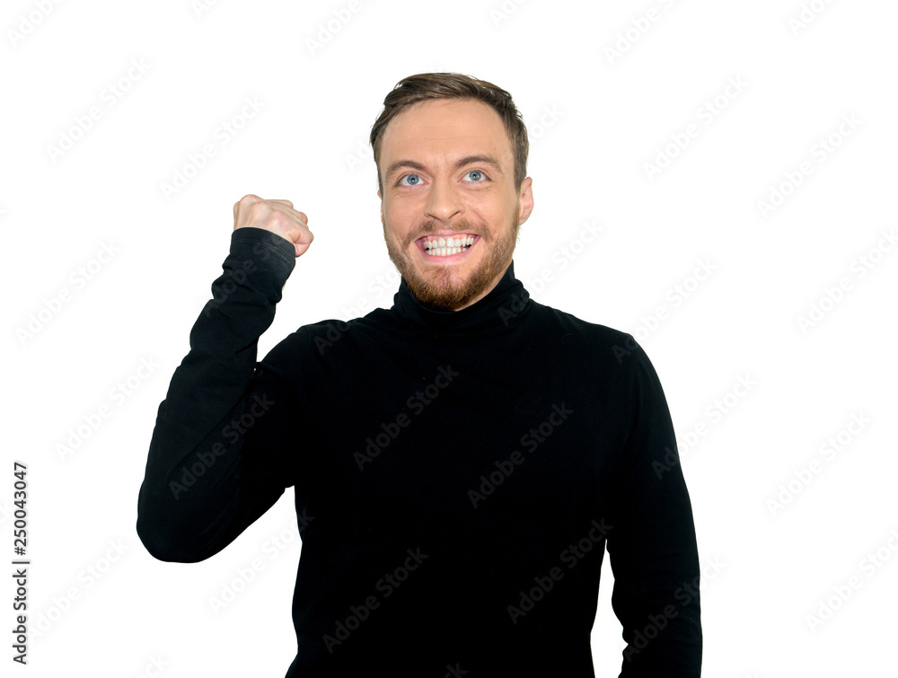 Fototapeta premium Cheerful handsome man opened mouth and squeeze fists, rejoices his triumph, was overjoyed expression, isolated on white background. People, success, body language concept