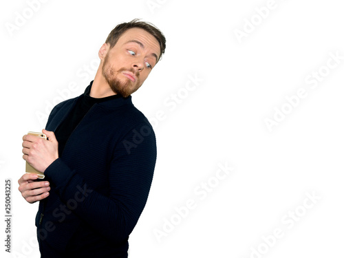 Portrait of a young casual man looking over the shoulder, isolated on a white background.