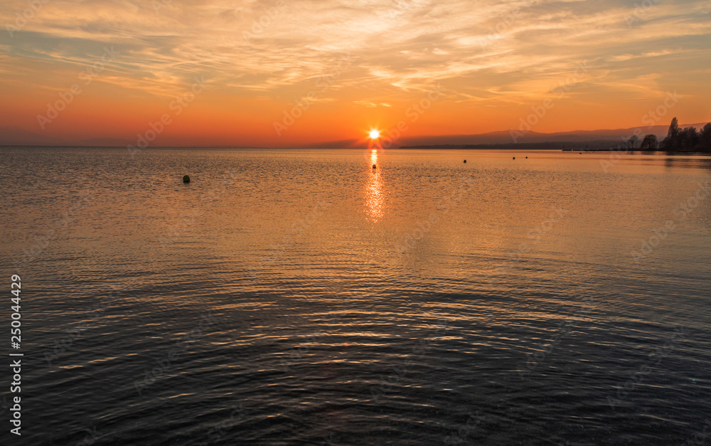 Naklejka premium Sunset. Peaceful. Colorful. Water. Lake. Leman. Sky