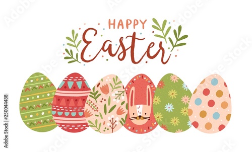 Festive greeting card template with Happy Easter wish handwritten with elegant cursive font and decorated eggs on white background. Flat vector illustration for spring religious holiday celebration.
