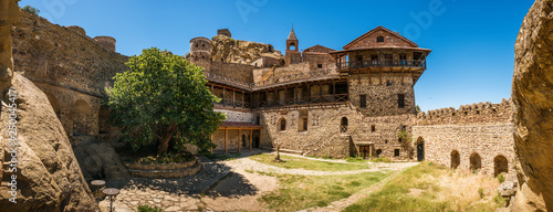 David Gareja is a rock-hewn Georgian Orthodox monastery complex in the Kakheti region of Georgia, on the half-desert slopes of Mount Gareja. The complex of cells and chapels hollowed in the rock face photo