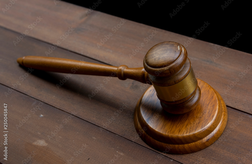 Judge's Gavel over black background Judge's Gavel over black background