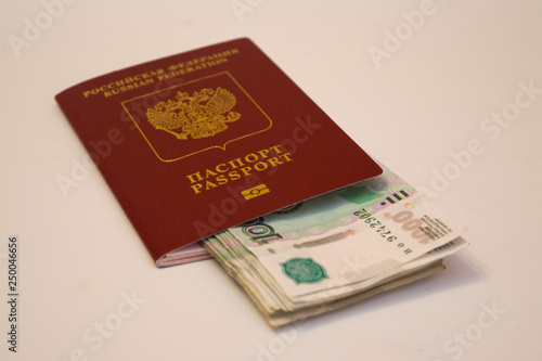 Russian passport and banknotes in denominations of 1 thousand rubles