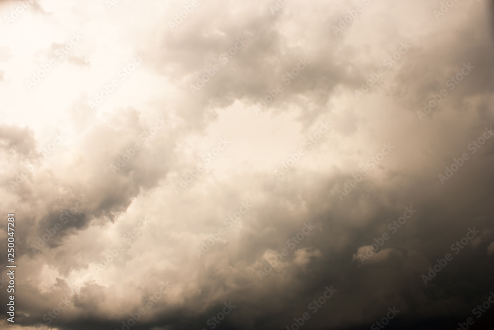 Obraz premium Gray sky, covered with solid clouds, clouds before the deterioration of the weather. Cloudy weather before the rain.