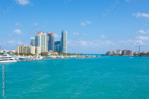 Miami, Florida, USA downtown skyline. Building, ocean beach and blue sky. Beautiful city of United States of America