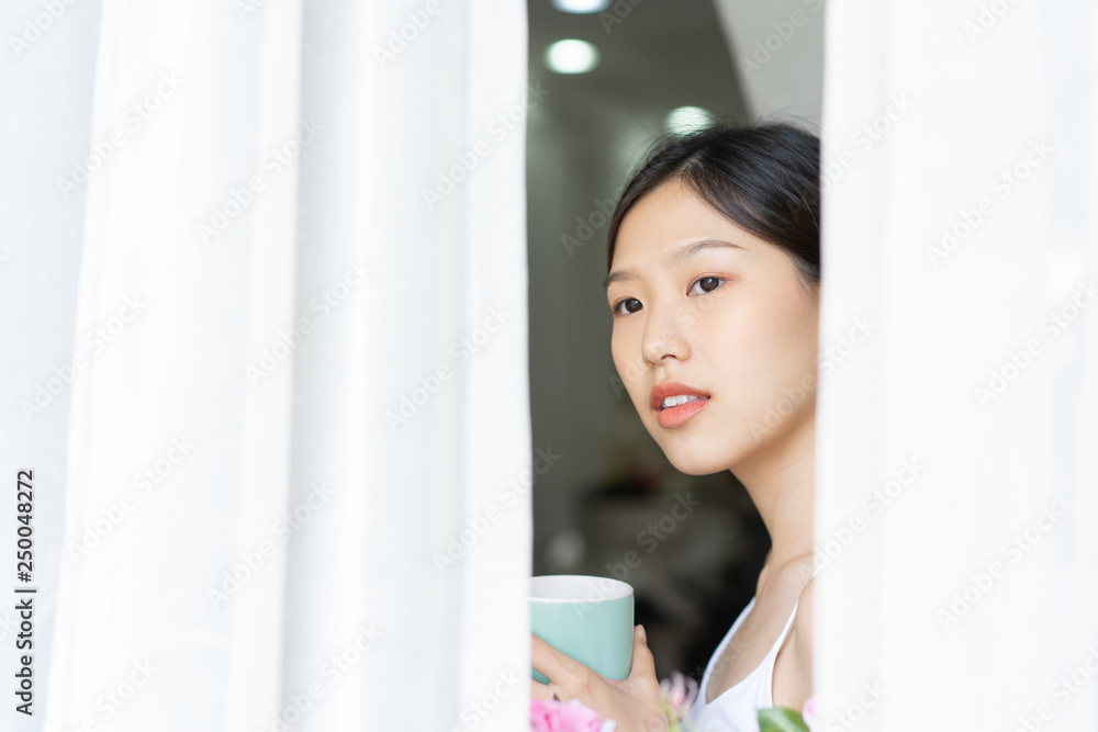Portrait Asian woman relaxing with coffee at home Portrait Asian woman relaxing with coffee at home