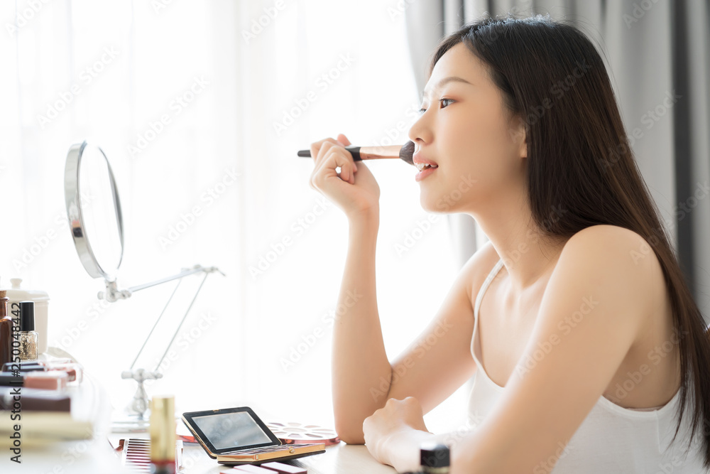 Young Asian female makeup beauty by Makeup Brush