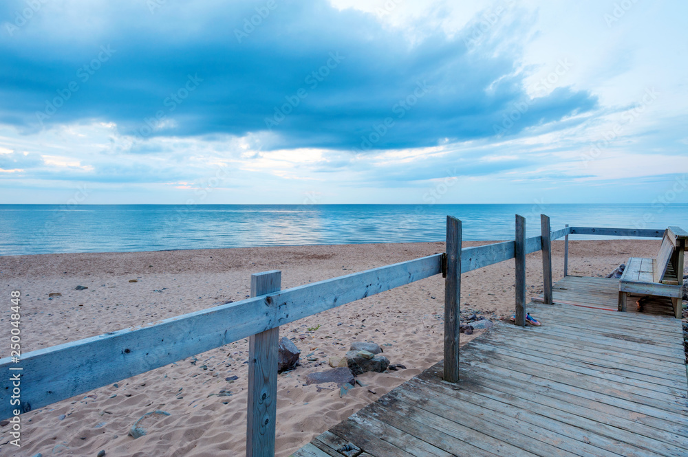 Bench on the Inverness beach at sunset, Nova Scotia, Canada Bench on the Inverness beach at sunset, Nova Scotia, Canada
