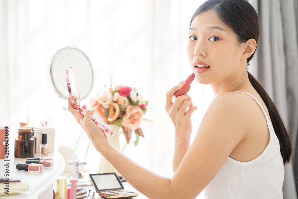 Young Asian female makeup beauty by lipstick Young Asian female makeup beauty by lipstick