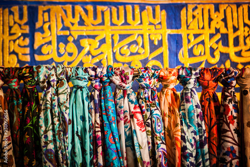 Display of colourful silk national scarves