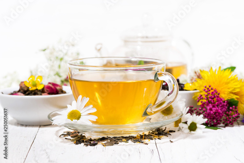 fragrant herbal tea in a cup on white background