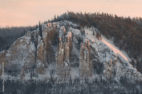 Lena Pillars at sunset on the frozen Lena river in the Natural Park Lenskie Stolby (Lena Pillars), Yakutia, Russia
